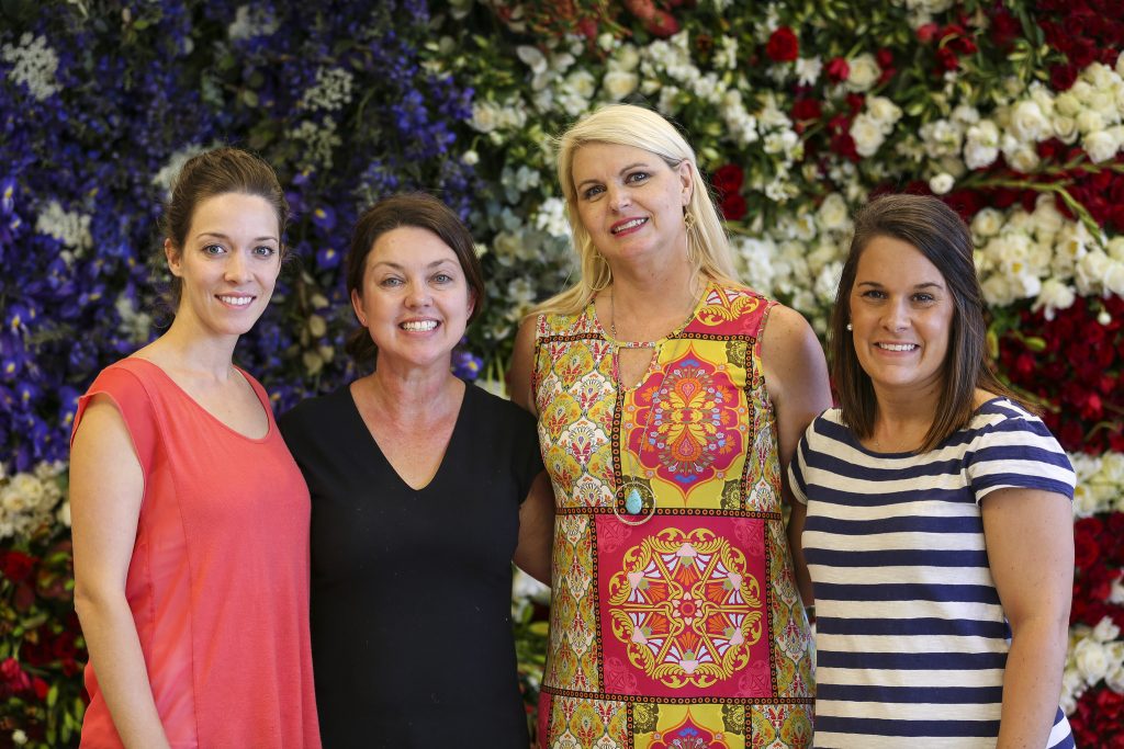 A few of the Colonial House and Chapel Designer team members, with Christy (second from left)